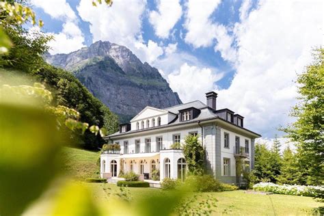 Manorial Estate In Front Of A Fantastic Mountain Scenery A Luxury