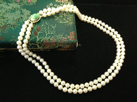 Mings Of Honolulu High Luster Pearl Necklace With Carved Jade Clasp Jade Carving Swag Pearl