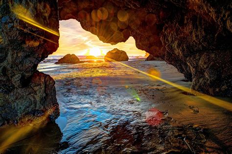 Ἄλλα δὲν ἔχει νὰ σὲ δώσει πιά. sea beach rock sunset landscape grotto cave rays sun ...