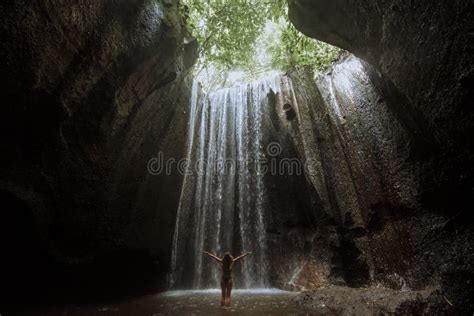 Tupad Cepung Waterfall Woman Stand In Underground Cave Pool Under