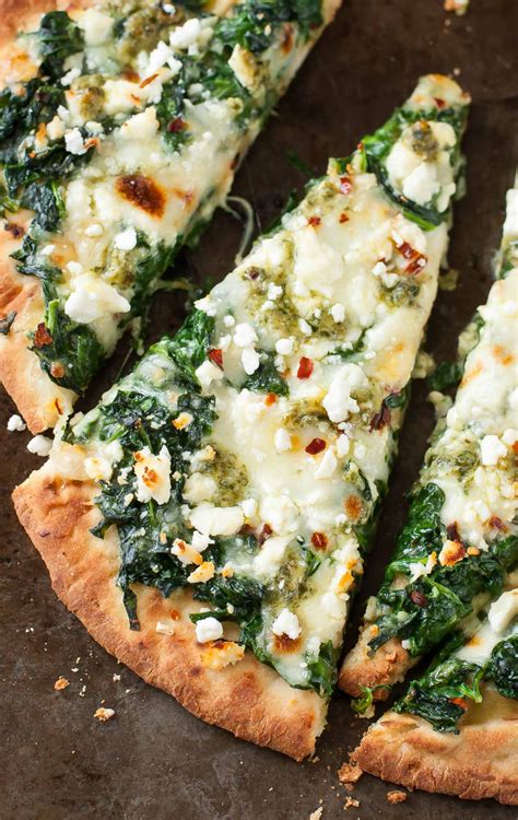 We're obsessed with this tasty vegetarian pizza recipe and it can be made with naan, pita, or your favorite flatbread. Three Cheese Pesto Spinach Flatbread Pizza Recipe - Peas ...