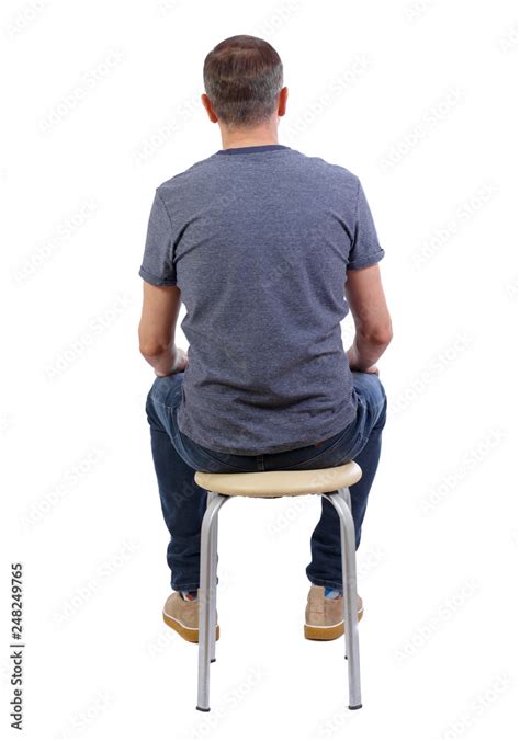 Back View Of A Man Sitting On A Chair Stock Photo Adobe Stock