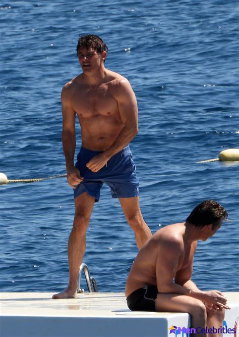 Tom Daley Strips Off And Displays His Rippling Muscles On The Beach