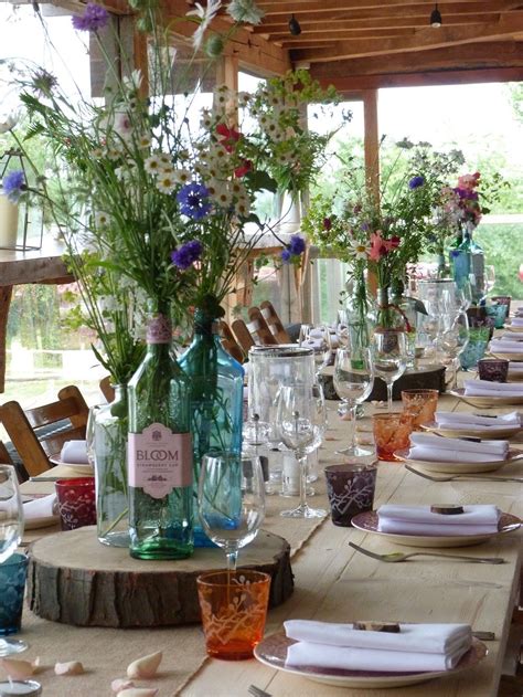 Modern wedding flowers daisy wedding floral wedding spring wedding wedding colours yellow wedding october wedding post wedding. Gin bottles with wild flowers | Vintage wedding ...
