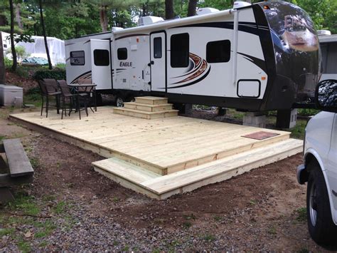 To level a travel trailer, you must first park about a foot from where you want your final spot to be. My camper deck | Camper steps, Campsite decorating, Trailer deck
