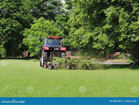 Tractor With Trailer Mowing Grass Stock Image Image Of Towing Mower