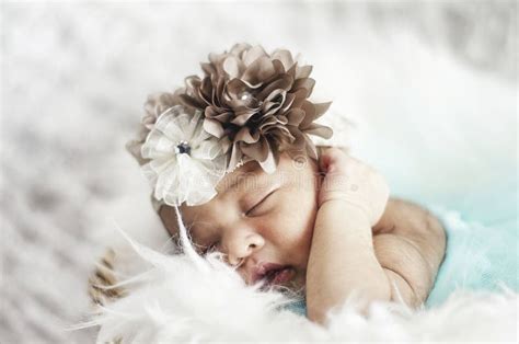 Portrait Of Cute Newborn Baby Sleeping On White Blanket Stock Photo