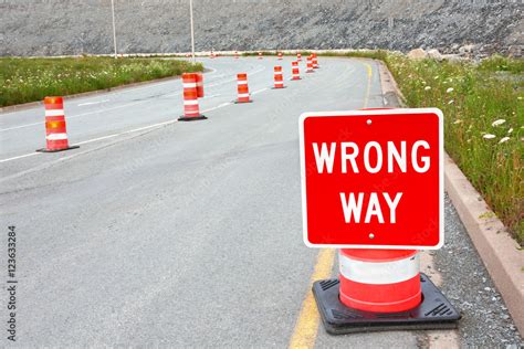Wrong Way Traffic Sign And Safety Cones Stock Photo Adobe Stock
