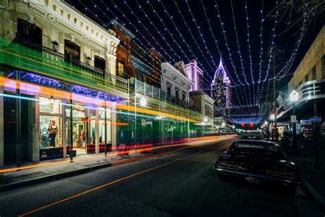 String Lights Hung Over Dauphin Street And Buildings In Downtown