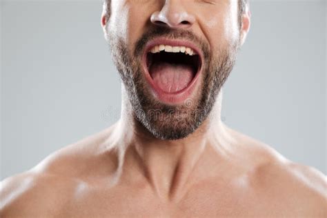Cropped Image Of Excited Mans Half Face With Naked Shoulders Stock