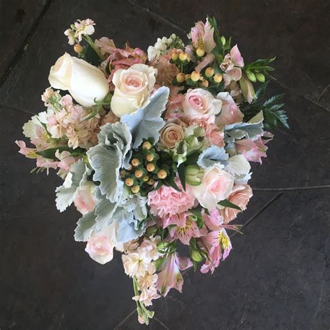 Slightly Cascading Wedding Bouquet Of Antique Pinks And Peaches With