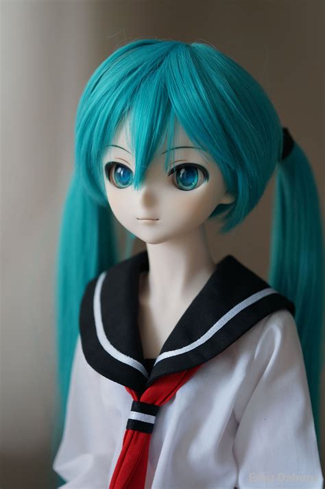 A Doll With Blue Hair Wearing A White Shirt And Red Tie Long Green Hair