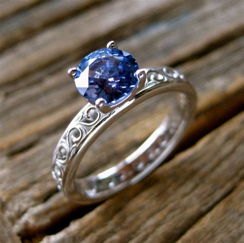 Light Blue Sapphire Engagement Ring In 18k White Gold With Floral