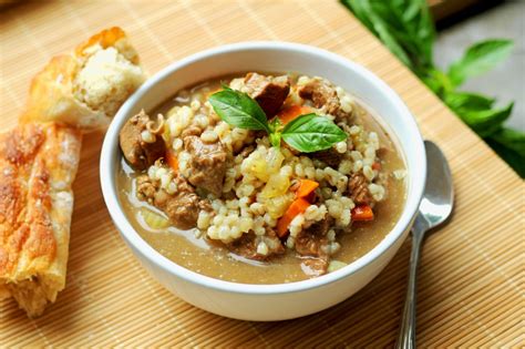 A hearty and delicious soup, loaded with tender chunks of beef, barley, fresh herbs and veggies! Beef Barley Soup - Gather for Bread