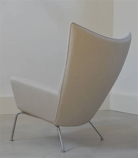 Danish modern furniture design legend, hans j wegner sketched an upholstered wing chair on a drawing board. Hans Wegner Wing Chair by Carl Hansen at 1stdibs