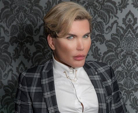 Is one man going too far in a bid to find perfection in himself? Human Ken doll shows off fake 'six pack' during beach ...