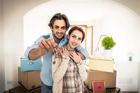 Young Couple Moving In Into New Apartment Stock Image Image Of House