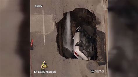 sinkhole swallows car while owner exercises at a gym in st louis abc