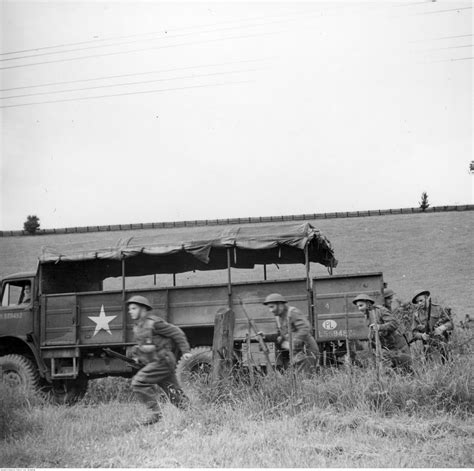 soldiers of the 1st armored division infantry disembark from the truck bedford 4x4 military
