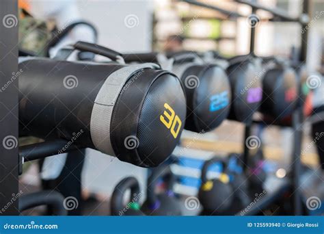 Black Leather Sacks And Dumbbells In Gym Weight Fitness Equipment