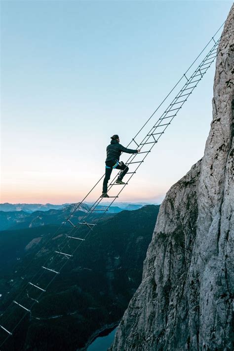 Daredevil Travellers Climb Terrifying Shaking Ladder Between