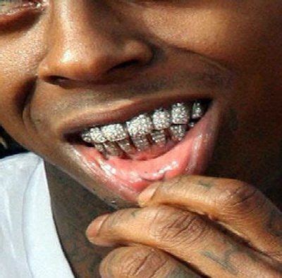 Lil wayne grill teeth tattoos bling glasses poster rap hip dental hop grills moda grillz diamond dreads rapper tattoo revistaweb. bedazzled teeth, can't afford a place to live, but, looks ...