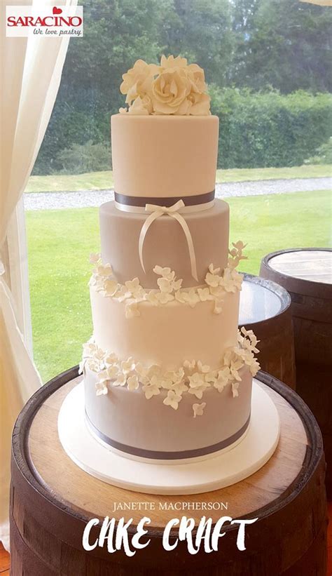 Modern custom four tier square wedding cake with grey and silver scattered pearls. 4 tier grey/white wedding cake - cake by Janette - CakesDecor
