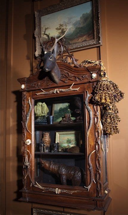 You'll also find the accessories and details that make a room complete. This small Black Forest cabinet is located just outside ...