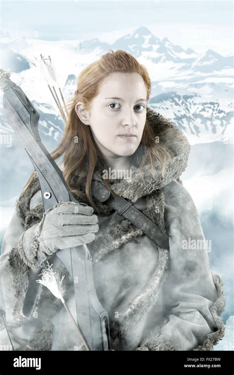 Wild Girl Archer In The Snow With Bow Stock Photo Alamy