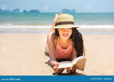 girl in bikini reading a book on beach stock image image of attractive girl 93572603