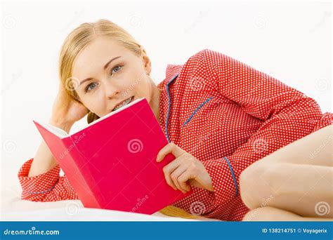 woman relaxing in bed reading book stock image image of reading woman 138214751