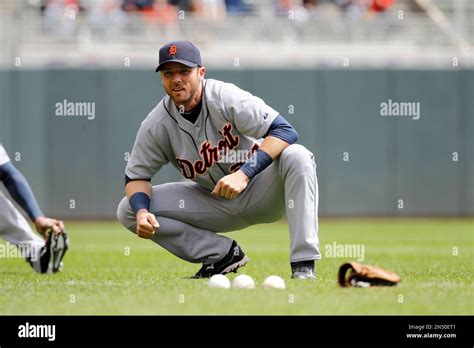 Detroit Tigers Shortstop Andrew Romine Stretches Before A Baseball Game