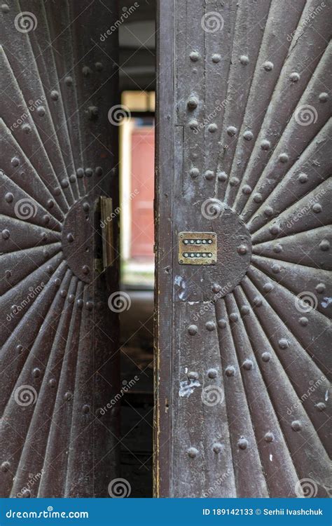 A Slightly Open Vintage Front Door Blurred Entrance And Part Of