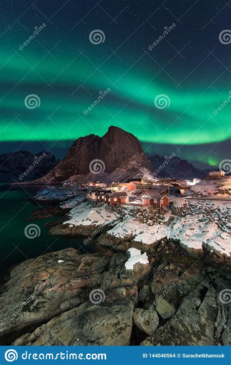 Northern Lights Over The Hamnoy Village At Night In Winter Season