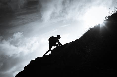 Man Climbing Up A Mountain Stock Photo Download Image Now Istock