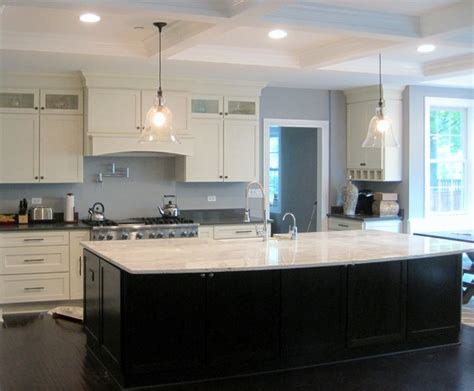 This stunning dark blue kitchen boasts an enormous island with ample seating. White shaker kitchen, large dark island - Modern - Kitchen ...