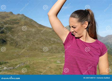 Sportswoman Smelling Stinky Armpit In Nature Stock Photo Image Of