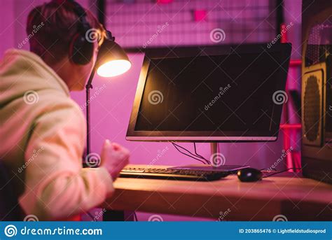Concentrated Young Gamer In Headset Play Stock Photo Image Of Blur