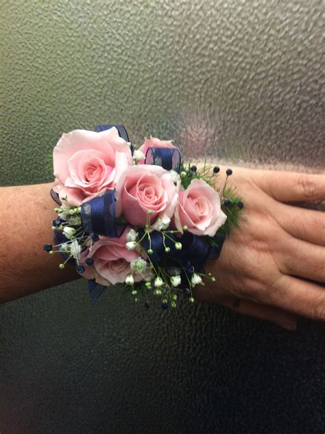 pink spray rose corsage with navy blue ribbon prom corsage pink prom corsage and boutonniere