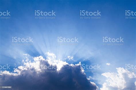 Sun Rays Through The White Clouds Background Blue Sky And Clouds Stock