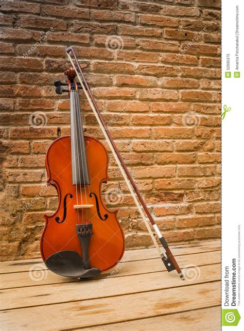 Violin On Brick Wall Background For Text Music Stock Photography