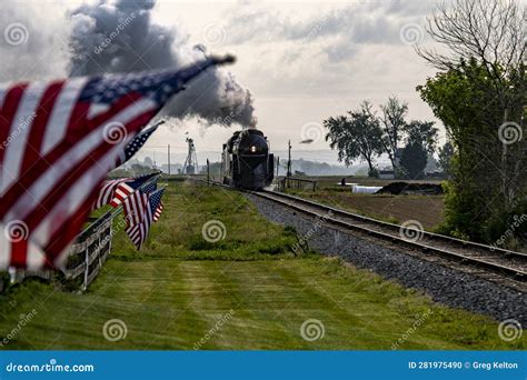 Steam Locomotive Approaching Blowing Lots Of Smoke With A America Flags