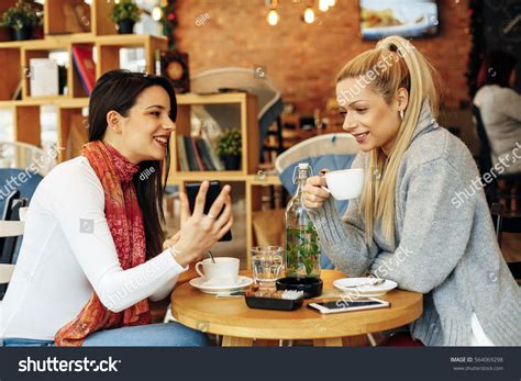 Two Women Drinking Coffee Cafe Talking Stock Photo 564069298 Shutterstock