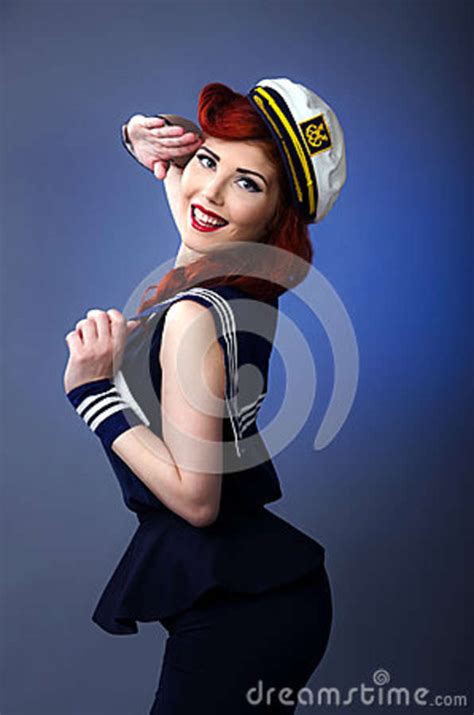 Pin Up Model In Sailor Costume Isolated On Blue Background Stock Photo