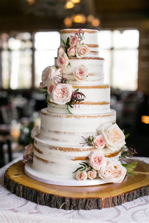 Layer cake decorated with chocolate glaze, cream flowers and che. Zach's Cabin Winter Weddding | Wedding cake rustic ...