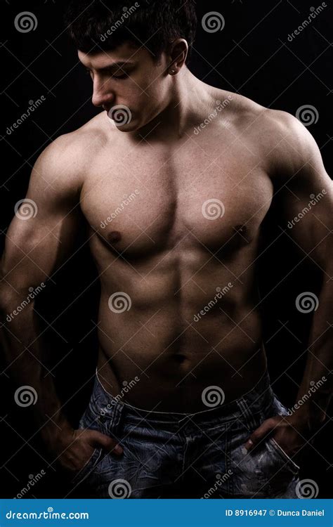 Muscular Shirtless Retro Builder On Top Of A Brick Wall Royalty Free