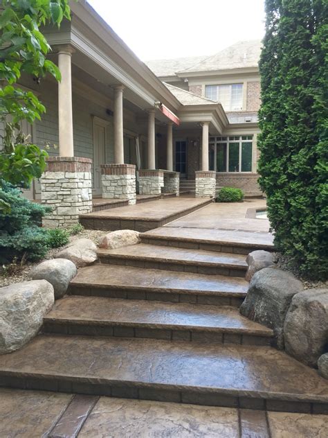 Stamped Concrete Pool Deck With Custom Chiseled Stone Cantilevered Coping By Sierra Concrete