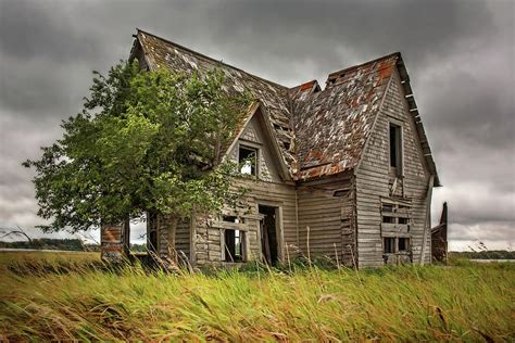 Foreboding Abandoned Farmhouse On The Nd Prairie By Small Lake