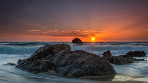 Download 1920x1080 Wallpaper Rocks Beach Coast Skyline Sunset Full