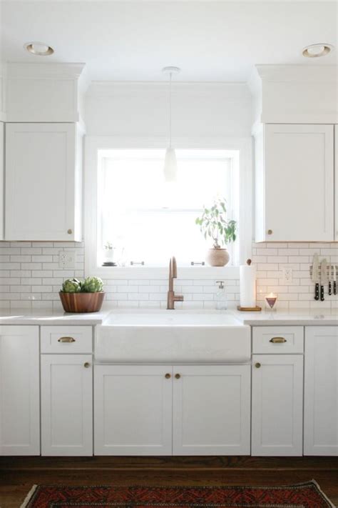 Eventually, on edges that butted up to a cabinet or window where tiles needed to be cut to fit, we ended up leaving an uneven gutter and assumed it wasn't a big deal since we'd be filling the gaps with grout or caulk later. HOUSE*TWEAKING | Kitchen soffit, Above kitchen cabinets ...